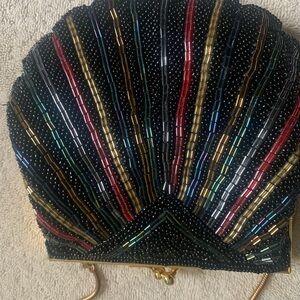 Black and Red Seashell Wristlet with Metallic Highlights